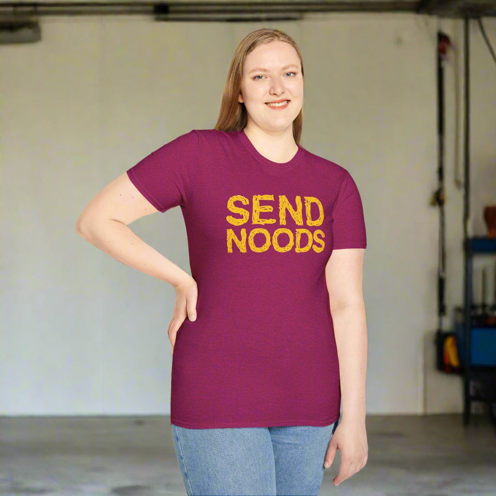 Person wearing a purple t-shirt with 'SEND NOODS' in yellow text on a white background