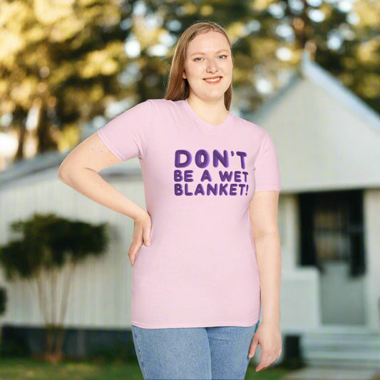 Person wearing a pink t-shirt with 'DON'T BE A WET BLANKET!' text on a white background