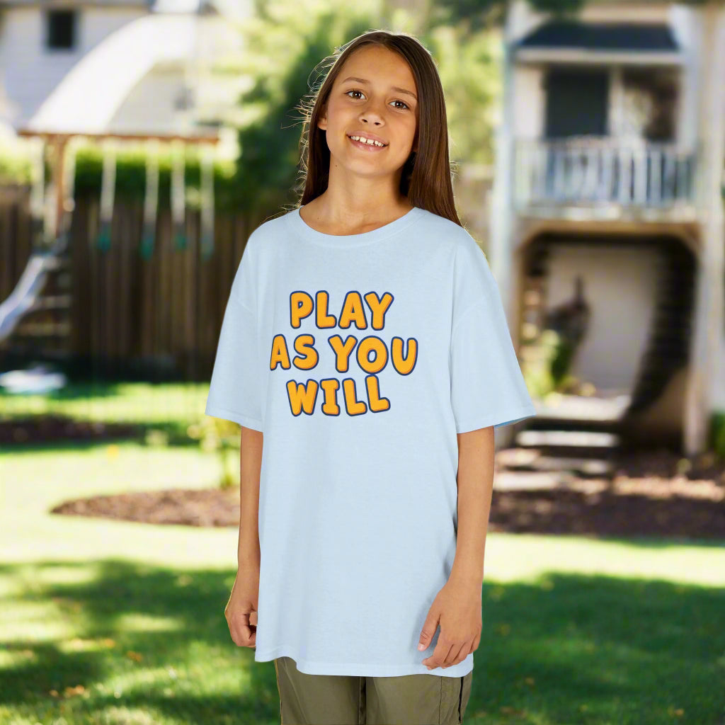 Child wearing a light blue t-shirt with 'Play as You Will' text on a white background